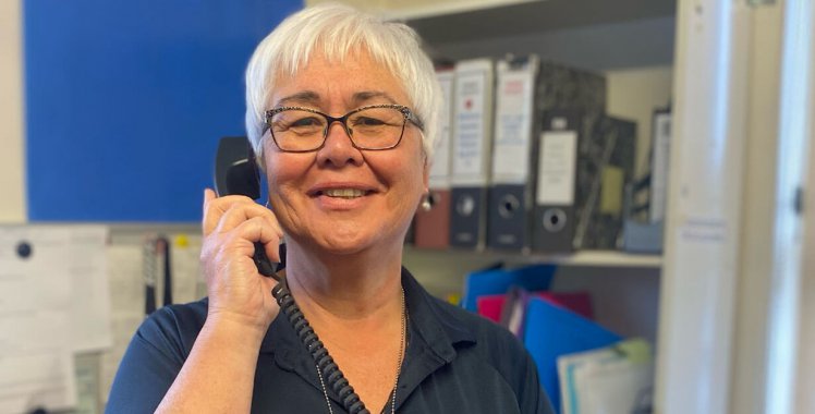 A lady speaking on a phone